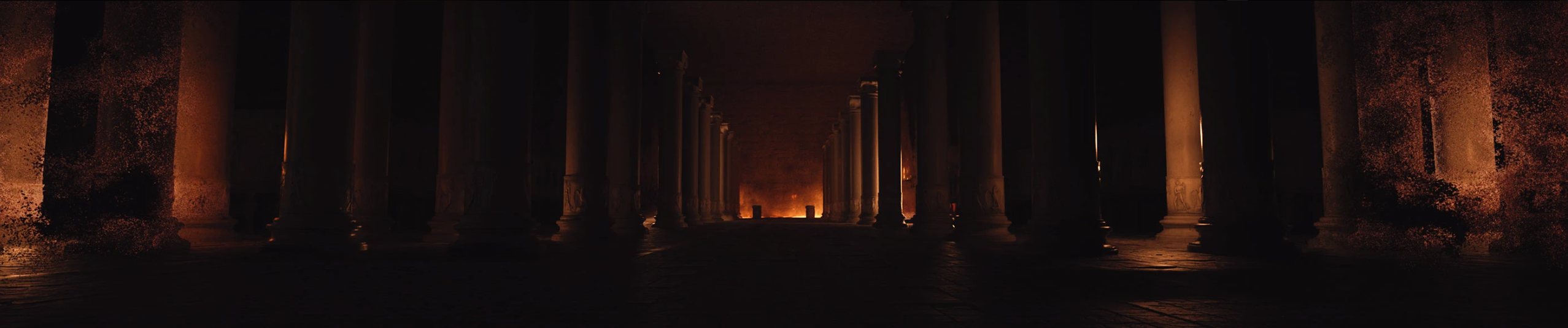 The darkened colonnade with the first flames glowing at its far end
